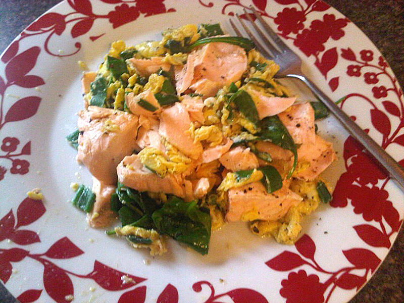 Poached salmon with scrambled eggs and spinach