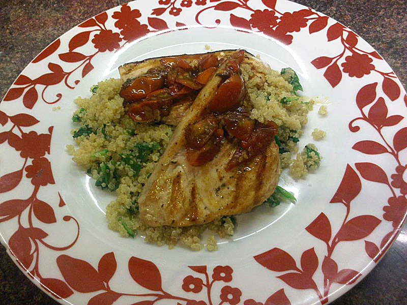 Char-grilled swordfish and coconut and spinach quinoa with tomato and garlic sauce