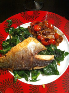 Pan fried sea bass with veg and pine nuts